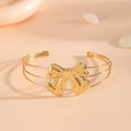 Women's bracelet with intricate bow design