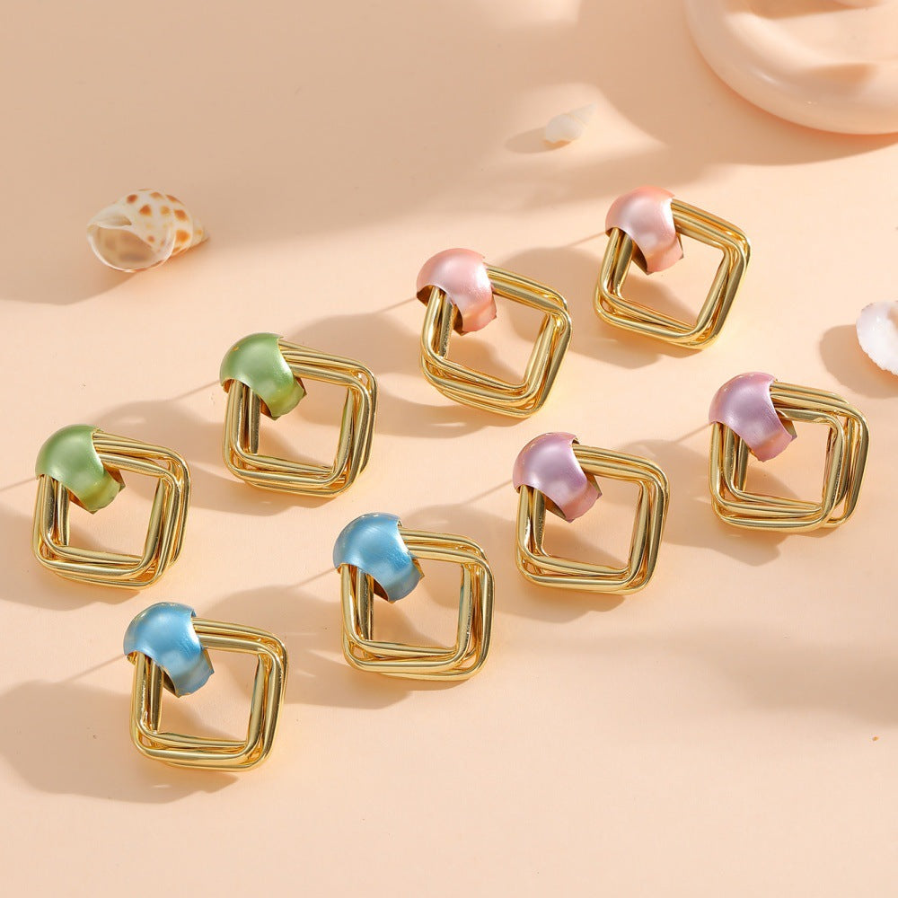 Women modern earrings with asymmetrical design