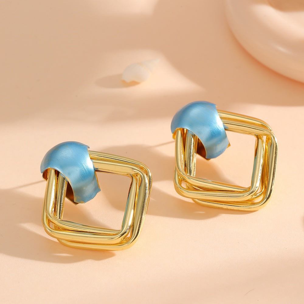 Women modern earrings with asymmetrical design