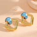 Women modern earrings with asymmetrical design