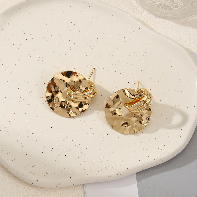 Women's elegant earrings with rustic, folded design
