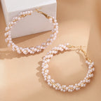 Ladies hoop earrings with luxurious pearl accents and elegant, twisted design