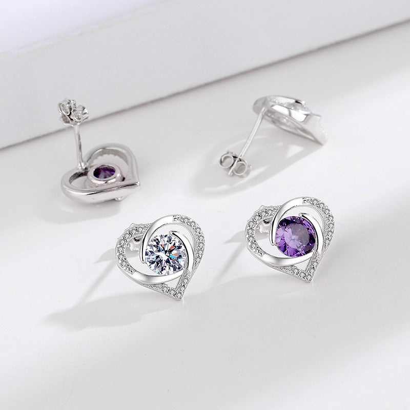 Ladies earrings in elegant heart design with shimmering zirconia