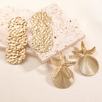 Women's ear clips in luxurious shell and starfish design
