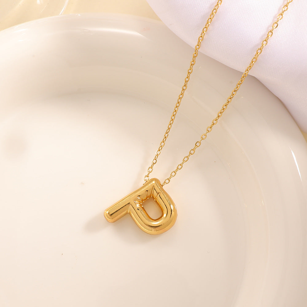 Women's necklace with curved letter pendant