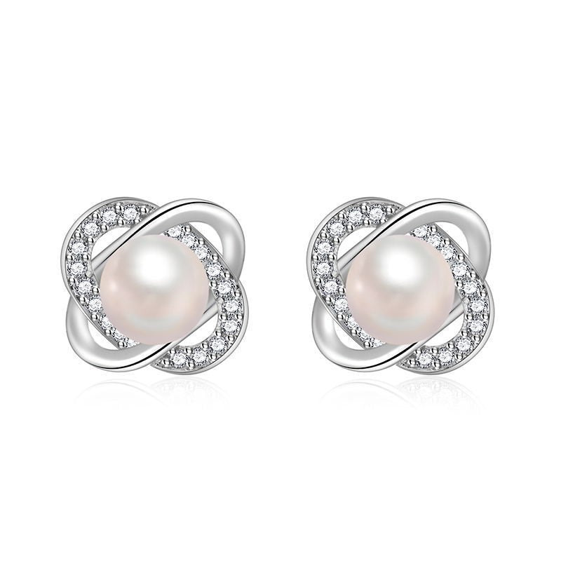 Ladies earrings with artistic pearl design and sparkling zirconia