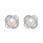 Ladies earrings with artistic pearl design and sparkling zirconia