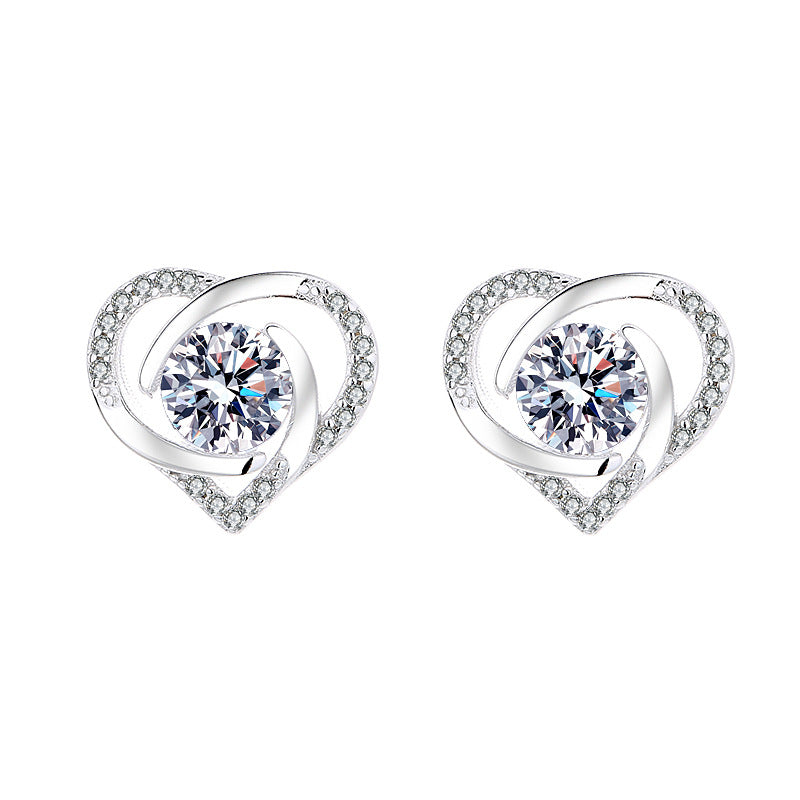 Ladies earrings in elegant heart design with shimmering zirconia