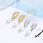 Ladies earrings with elegant zirconia decorations and pearl pendants