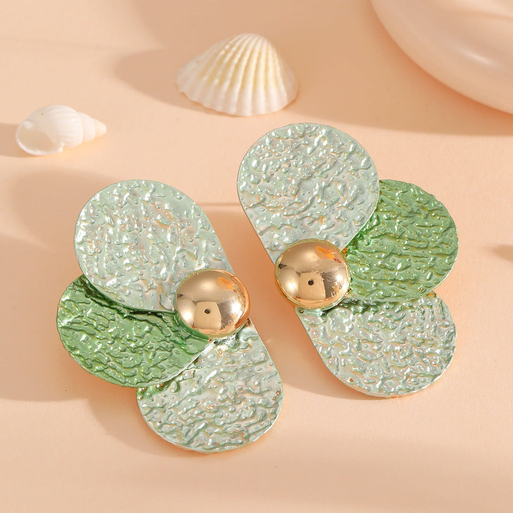 Women's ear clips in elaborate floral pattern