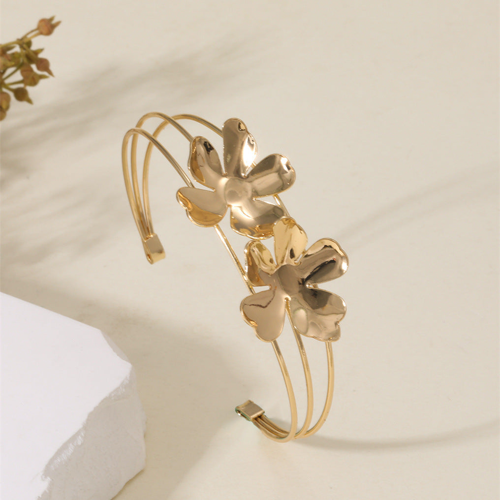 Women's cuff bracelet with artistic leaf motif