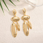Women Hanging Earrings with artistic, three-dimensional design
