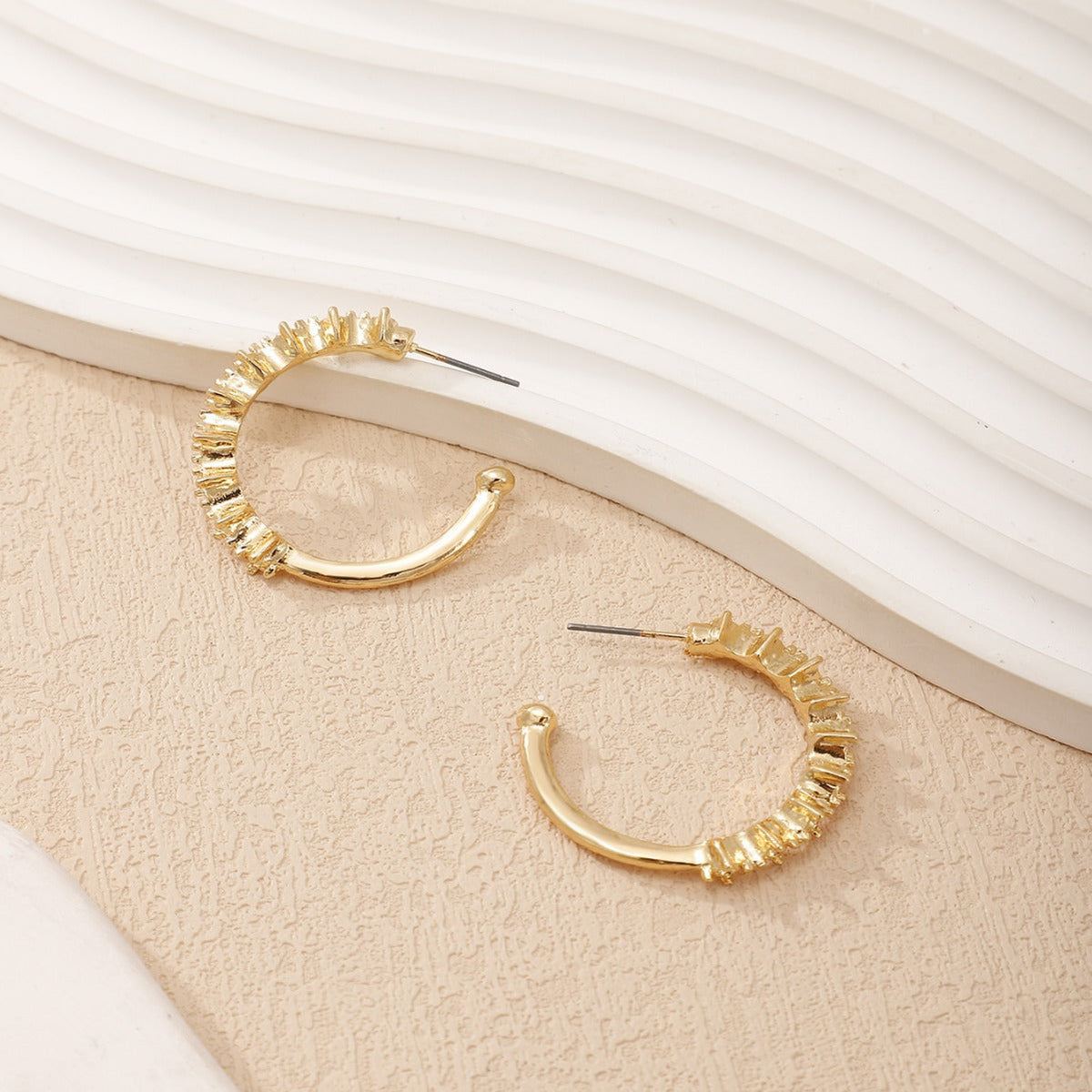 Ladies hoop earrings with intricate structures