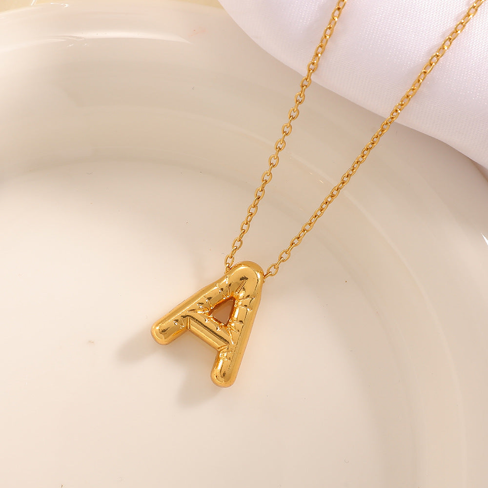Women's necklace with curved letter pendant