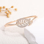 Women's bangle with elegant infinity pattern and sparkling zirconia