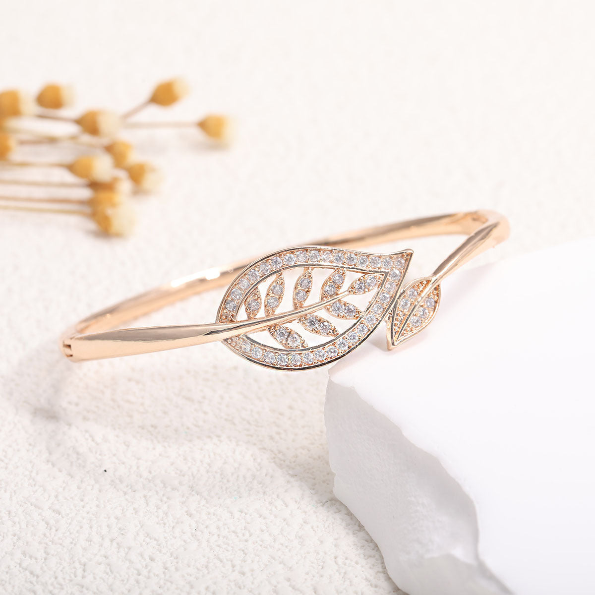 Women's bangle with elegant infinity pattern and sparkling zirconia