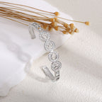 Ladies bracelet with elaborate infinity symbol and sparkling zirconia