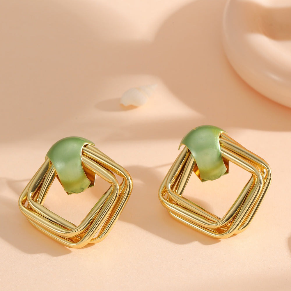 Women modern earrings with asymmetrical design
