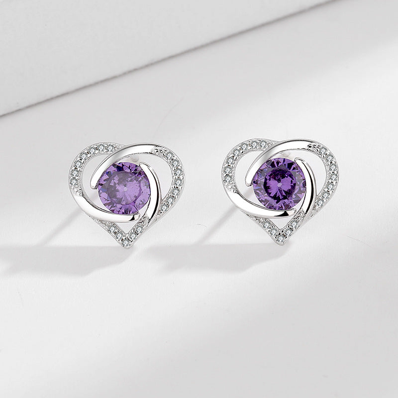 Ladies earrings in elegant heart design with shimmering zirconia