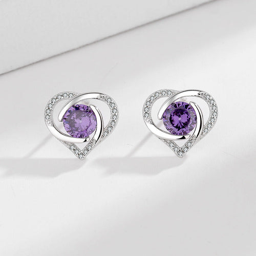 Ladies earrings in elegant heart design with shimmering zirconia