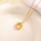 Women's necklace with curved letter pendant