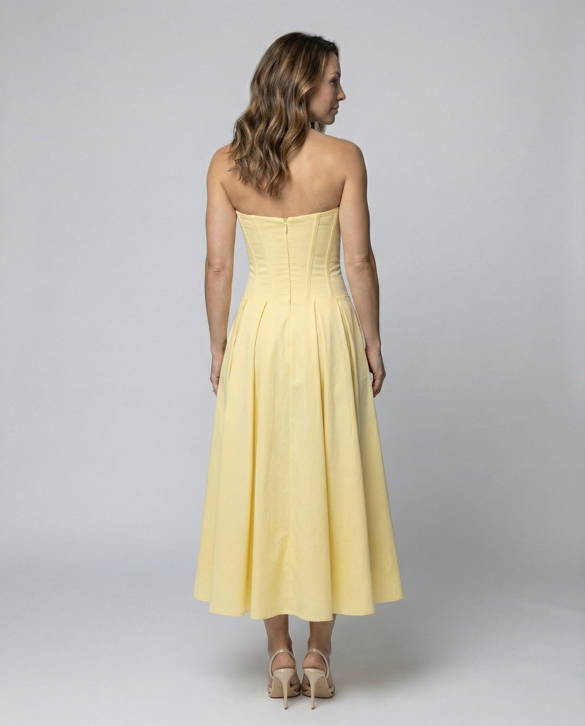 Women's evening dress with deep V-neck and flared skirt - back view