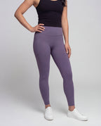 Women's high-waisted yoga leggings with crossover detail - lower body view