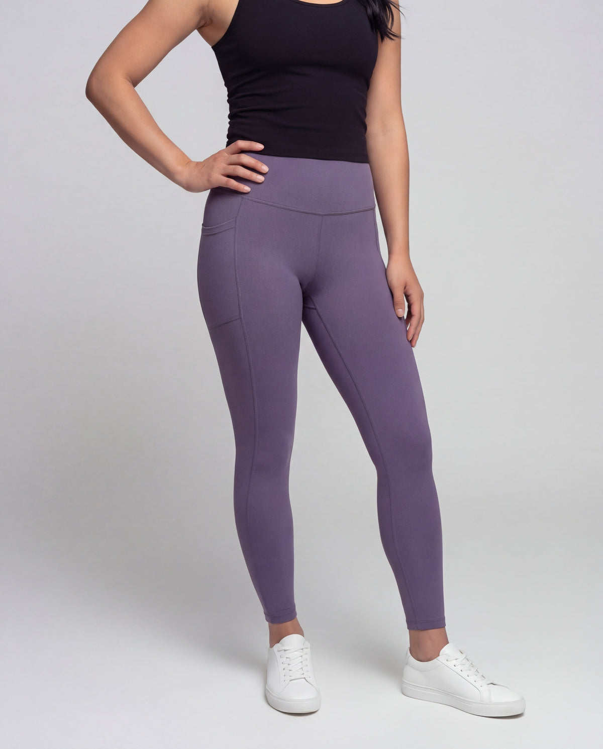 Women's high-waisted yoga leggings with crossover detail - lower body view