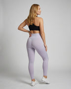 Women shaping leggings with tummy control effect - back view