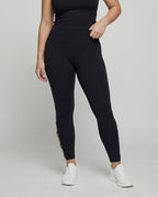 Women's waist-sculpting leggings with strap detail - lower body view