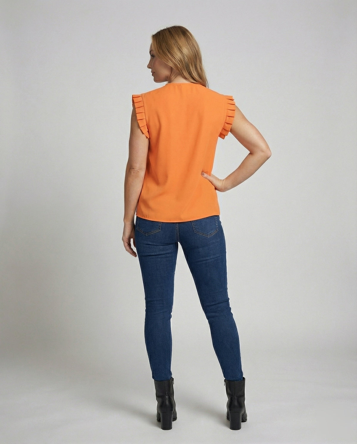 Women's pleated blouse top with structured sleeves - back view