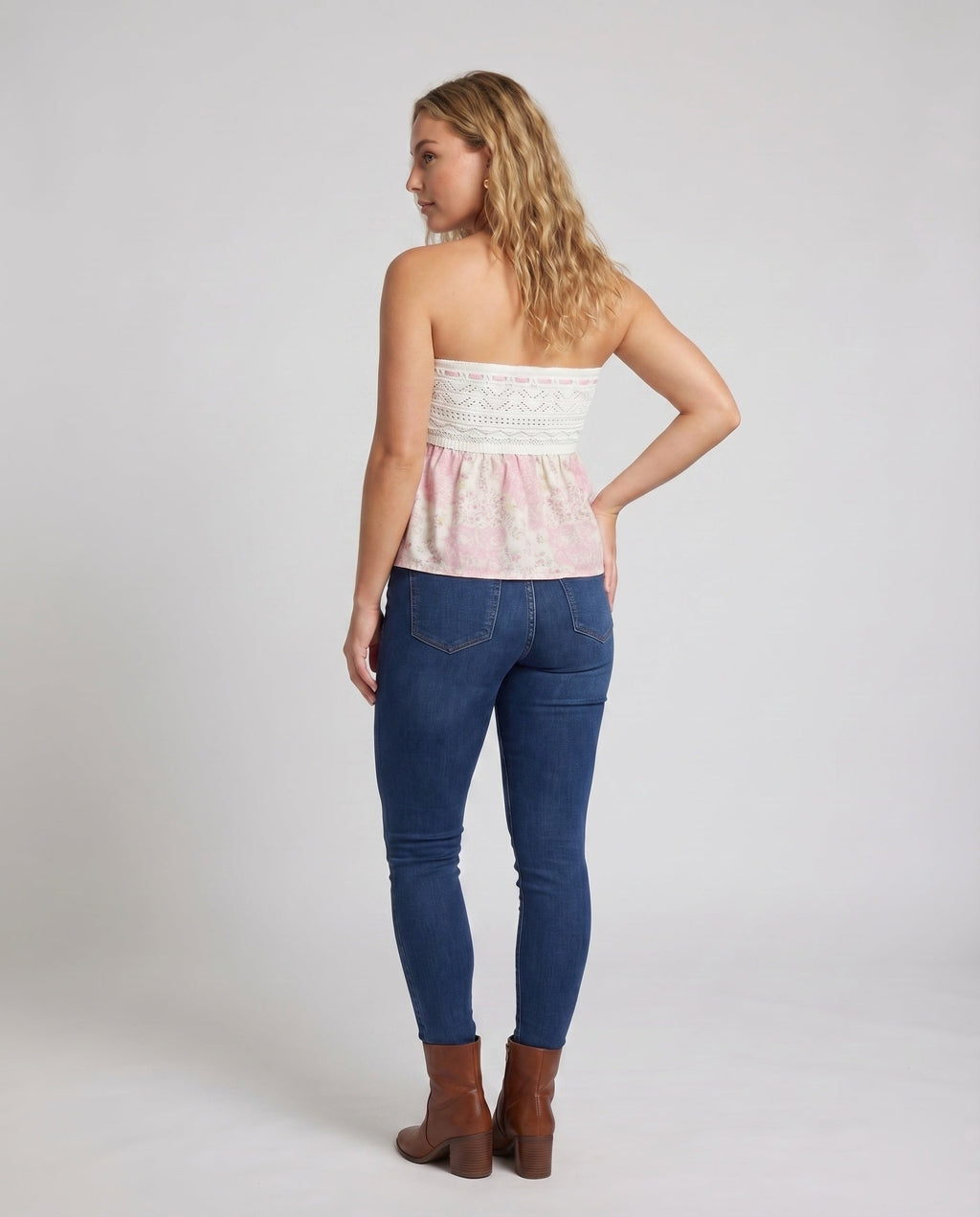 Women's sleeveless blouse top with romantic cut and ruffle details - back view