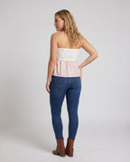Women's sleeveless blouse top with romantic cut and ruffle details - back view