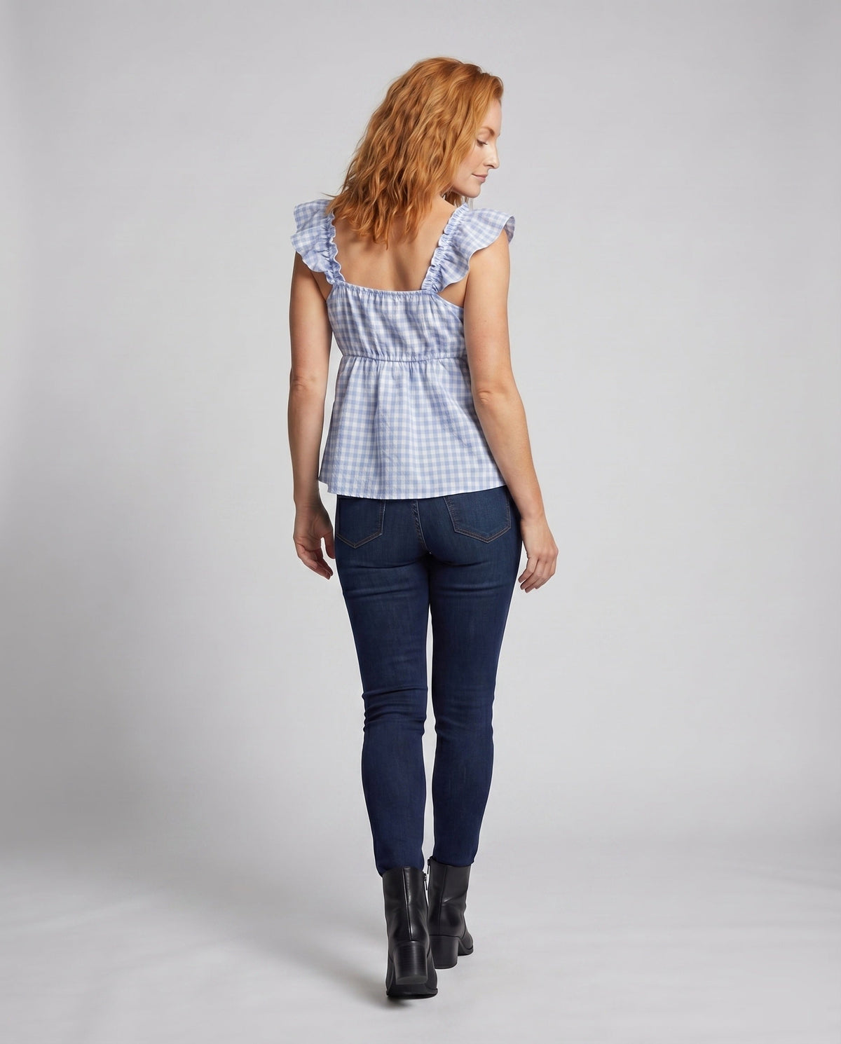 Women's blouse shirt with decorative ruffles and V-neck - back view