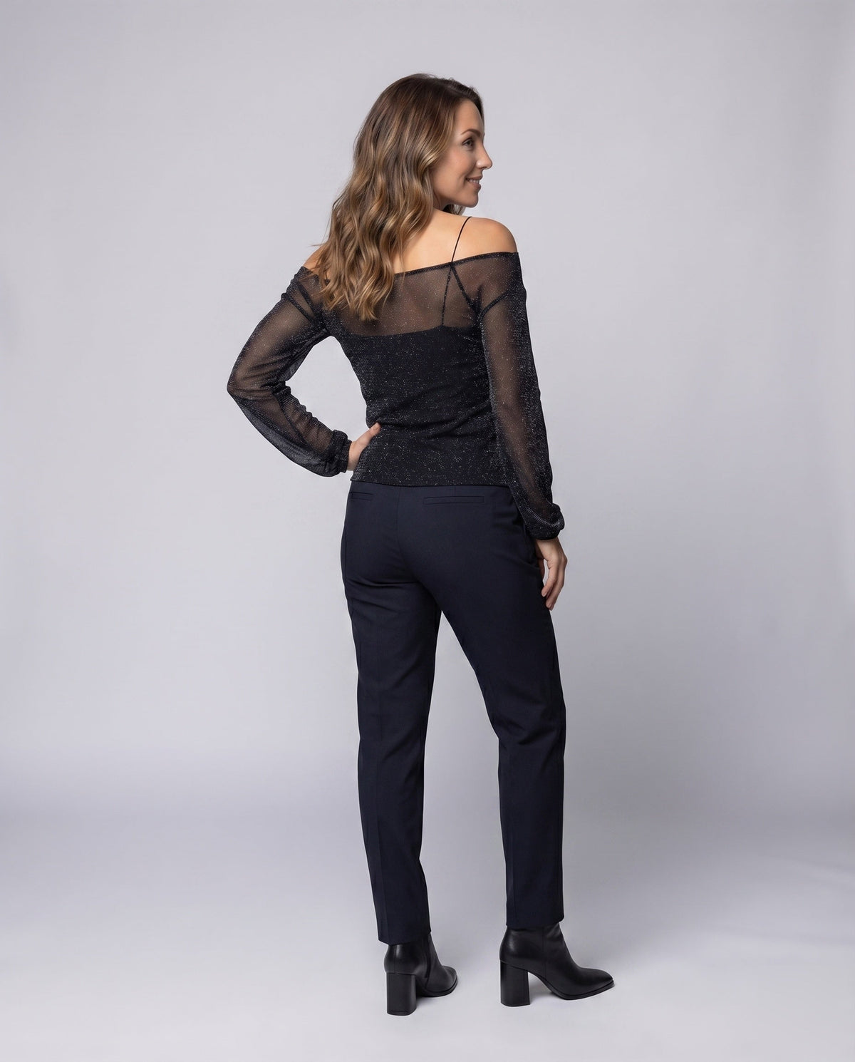 Women Elegant, sparkling blouse shirt with transparent sleeves - back view
