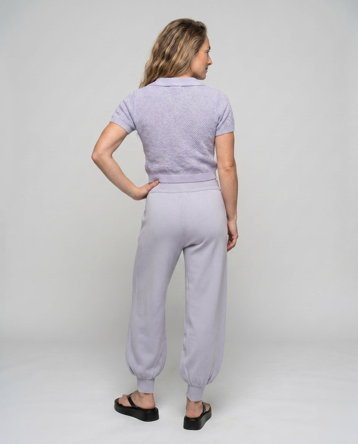 Women's casual knit set with short top and wide pants - back view