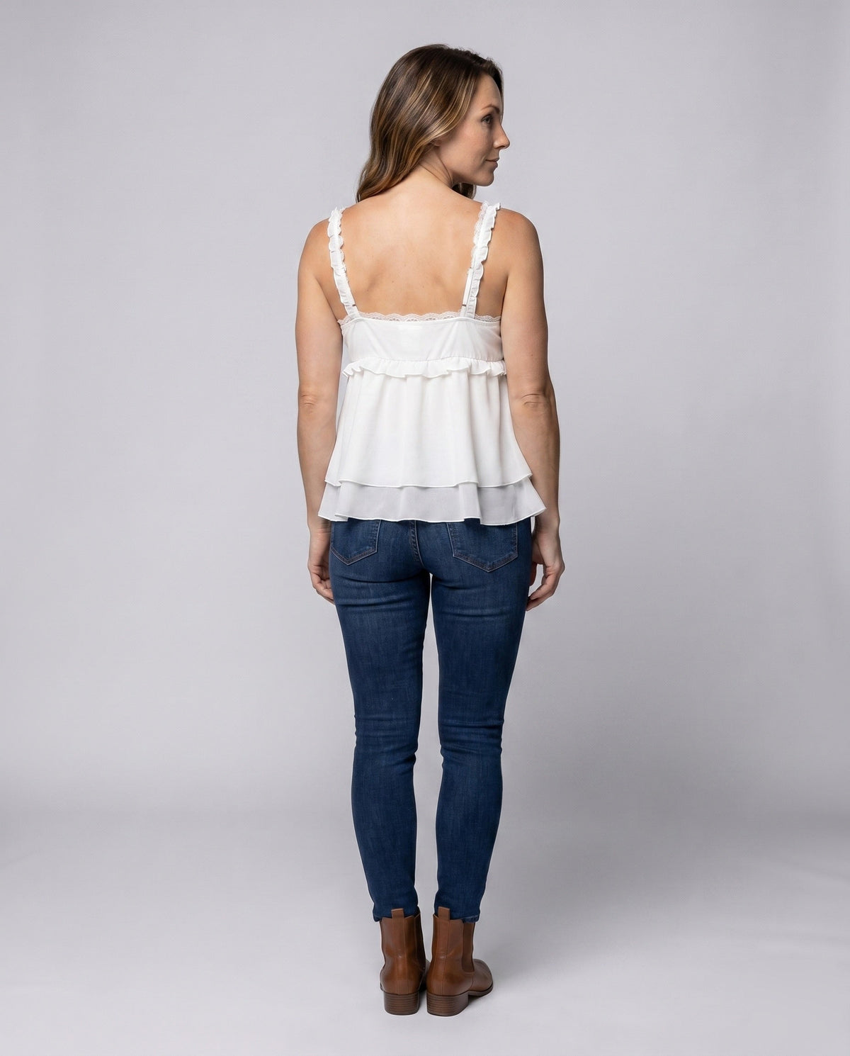 Women's airy blouse top with ruffle details and stylish drawstring - back view