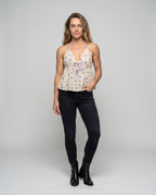 Women's airy blouse top with deep V-neckline and adjustable spaghetti straps - front view