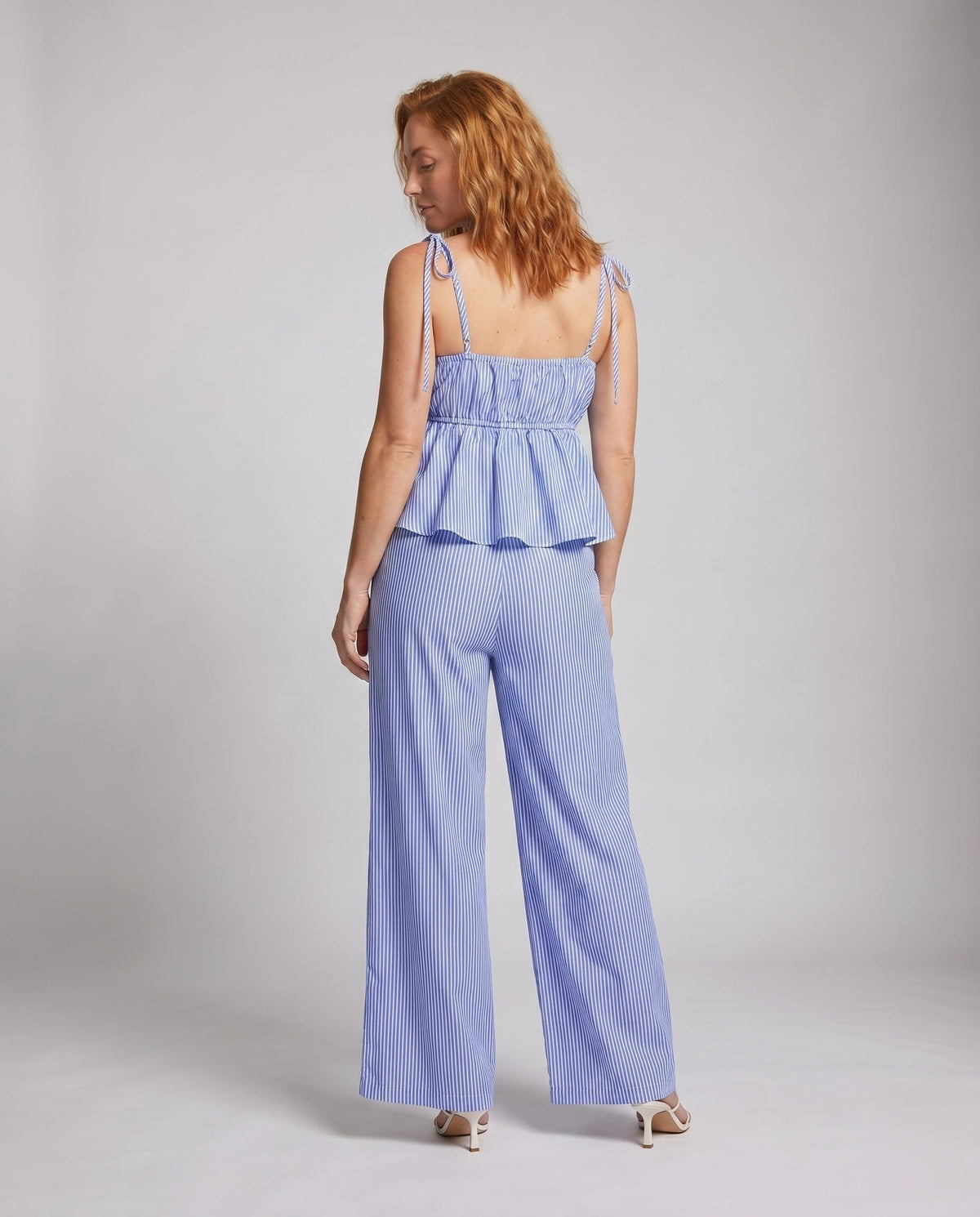 Women's two-piece set with lace top and wide trousers - back view
