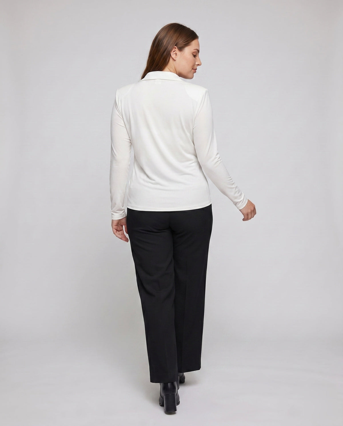 Ladies elegant long sleeve shirt with sophisticated wrap neckline and wide pants - back view