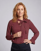 Women's blouse shirt with elegant bow tie and striped pattern - upper body view