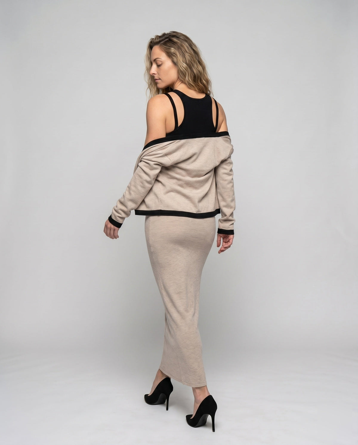 Women's figure-hugging dress with detachable sleeves and elegant design - back view