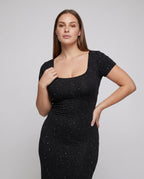 Women's figure-hugging dress with ruffle details and back lacing - upper body view