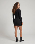 Women's form-fitting mini dress with stylish top and elegant ruffle details - back view