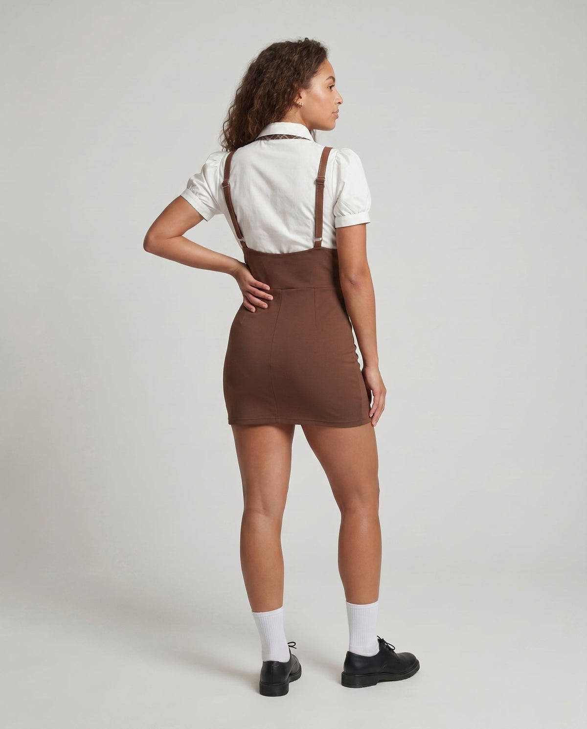 Women's dress with elegant wrap cut and ruffle details - back view