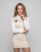 Women's dress with classic collar and embroidered crest - upper body view