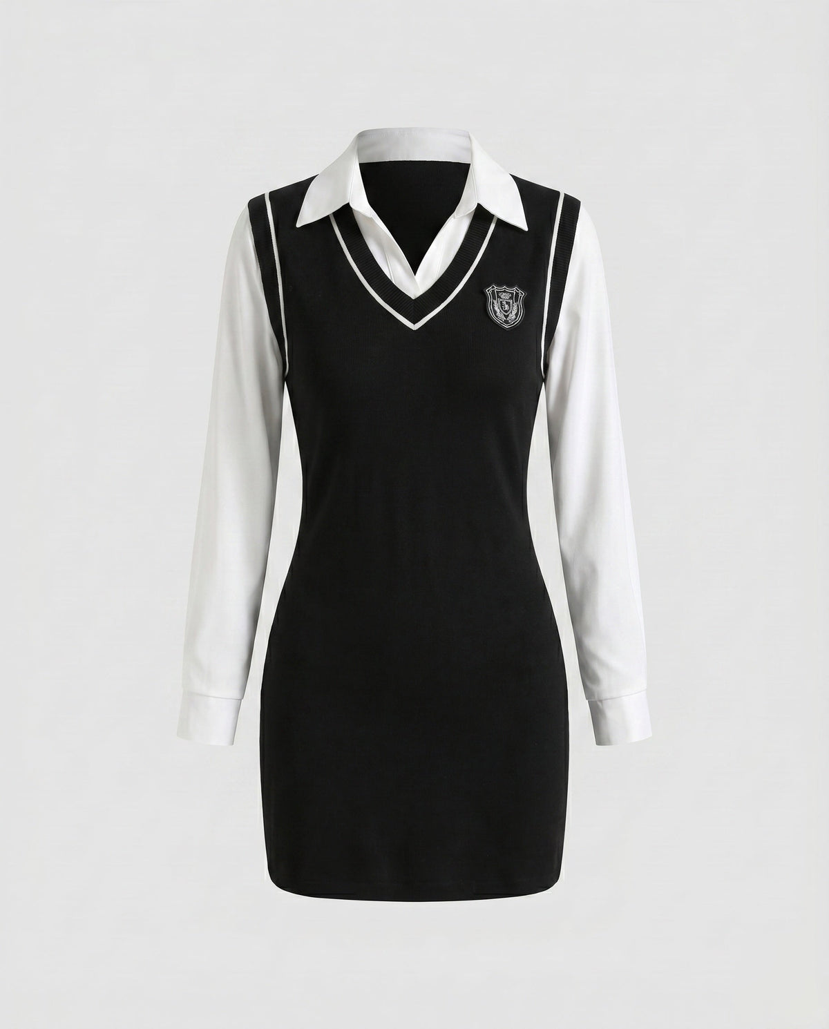 Women's dress with classic collar and embroidered crest - product shot