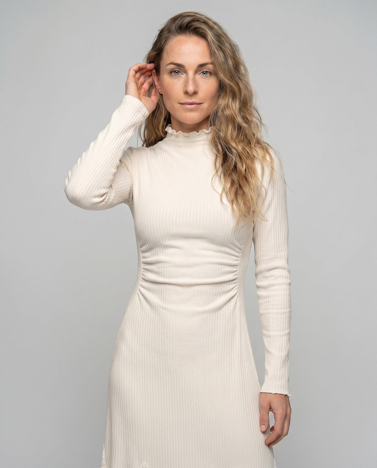 Women’s dress with sophisticated lace accents and elegant pleat design - upper body view