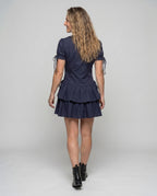 Women’s dress with ruffle details and flattering V-neck - back view