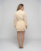 Women’s dress with voluminous ruffles and elegant wrap design - back view